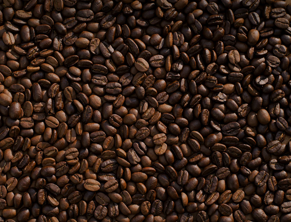 Dark, moody close-up of a perfectly pulled espresso with golden crema