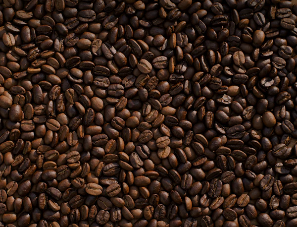 Dark, moody close-up of a perfectly pulled espresso with golden crema